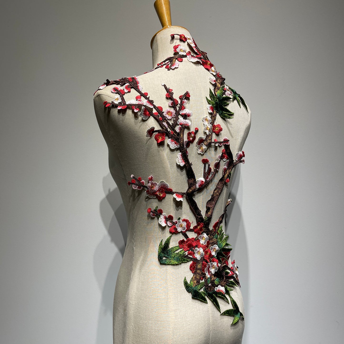 Plum blossom embroidery appliqué with delicate stitching