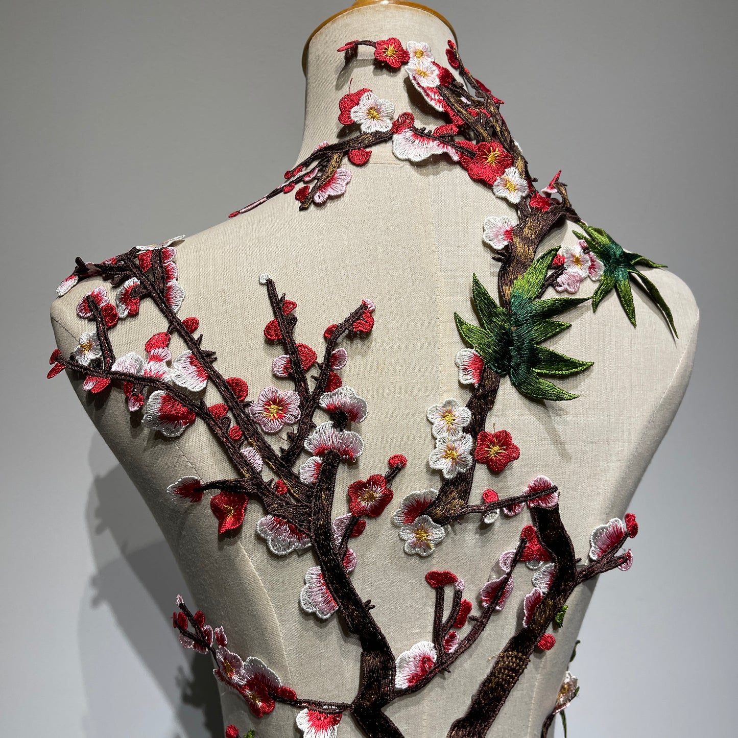 Plum blossom embroidery appliqué with delicate stitching
