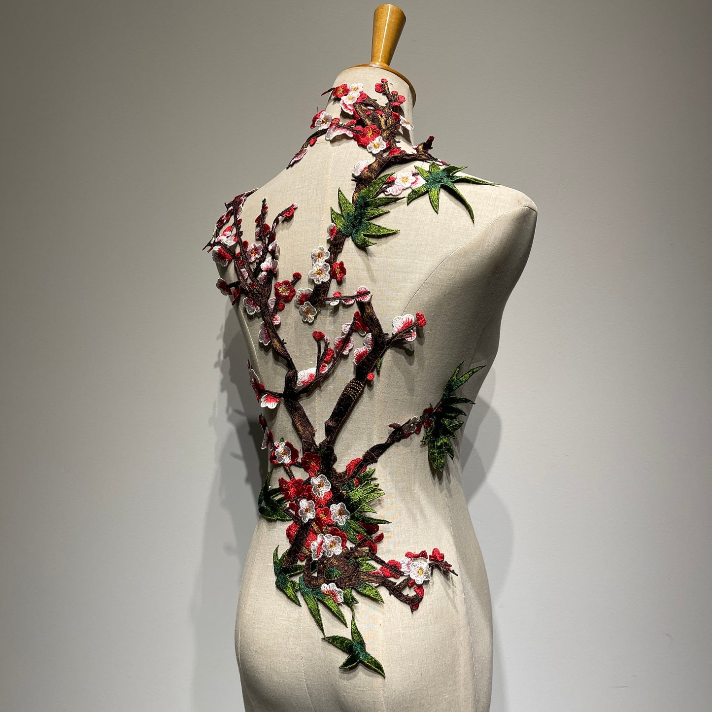 Plum blossom embroidery appliqué with delicate stitching