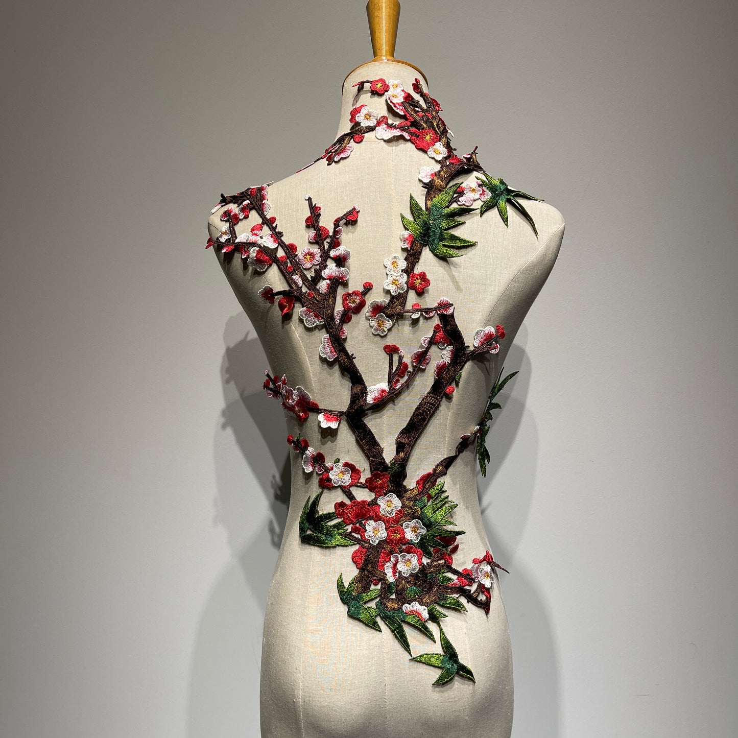 Plum blossom embroidery appliqué with delicate stitching