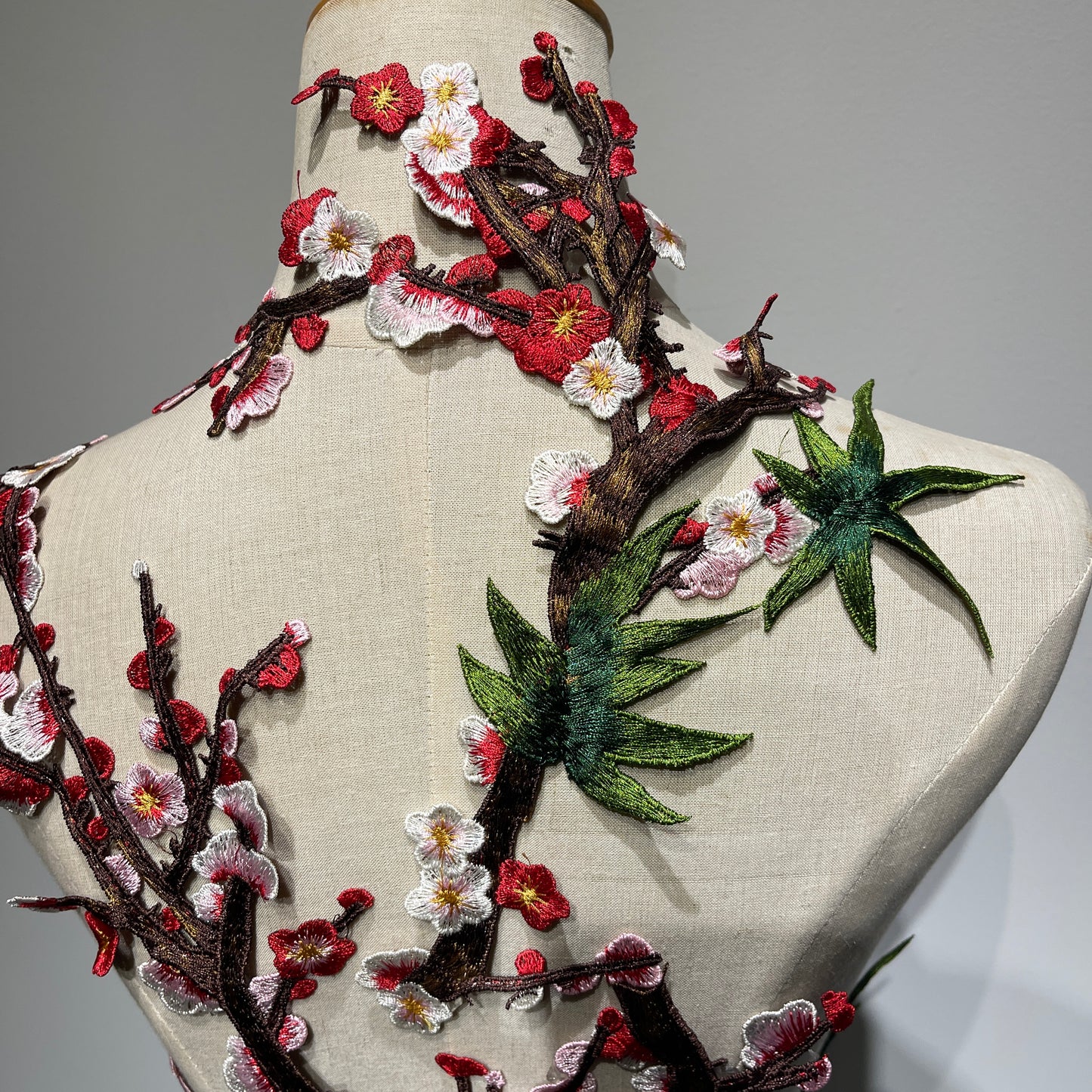 Plum blossom embroidery appliqué with delicate stitching