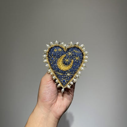 Front view of the 11.5x10cm Hand-Beaded Celestial Moon patch with a navy denim background, showcasing intricate gold thread stars, a gold embroidered crescent moon, and a luxury border of baroque pearls.