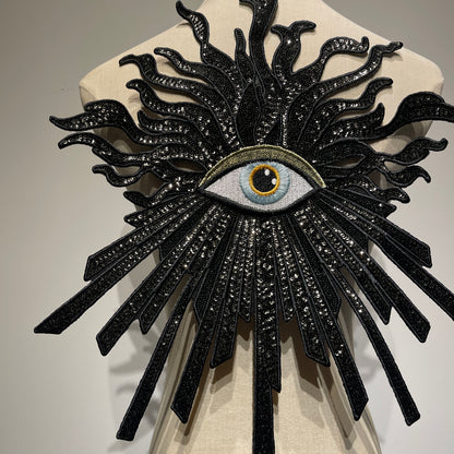 Close-up detail of handcrafted luxury evil eye patch, showcasing high-shine black sequins, premium embroidery beads, and intricate needlework.
