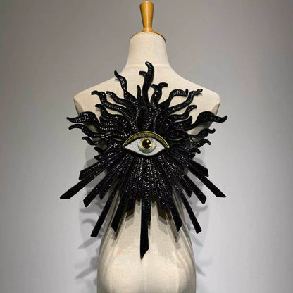 Oversized luxury black and gold evil eye sequin patch on a mannequin, handcrafted large embroidery back patch for jacket DIY custom fashion.