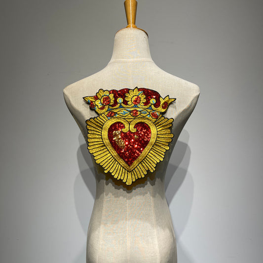 Large Sacred Heart and crown sequin embroidered back patch displayed on a mannequin torso, showcasing its scale for denim jackets.