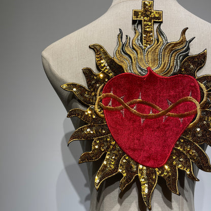 Close-up highlight showing shimmering gold cross and light-catching sequins on red velvet sacred heart patch patchmanstore