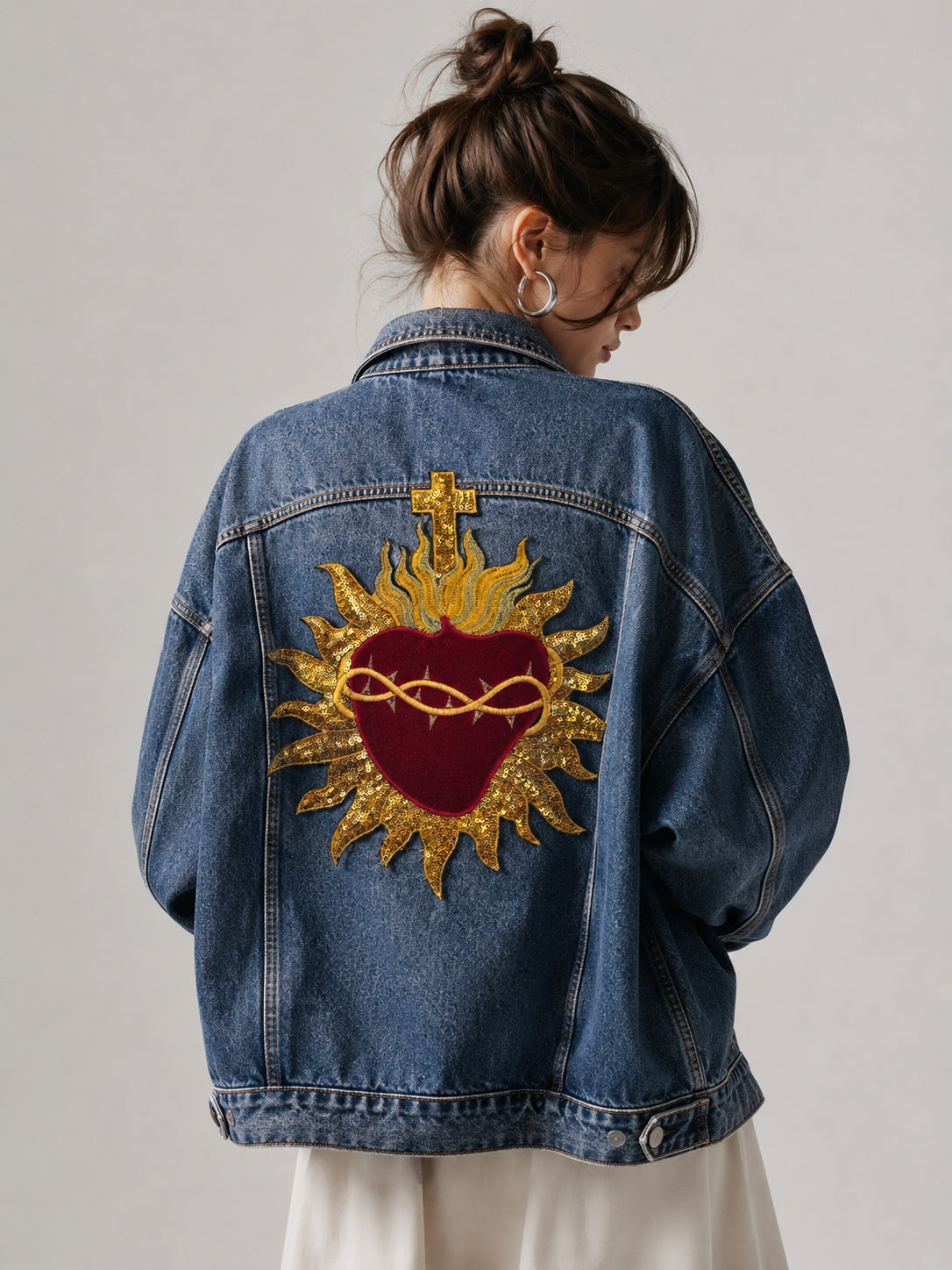 On-model lifestyle look of 29cm crimson red velvet sacred heart patch with gold sequins on the back of a vintage denim jacket patchmanstore